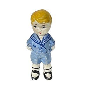 Antique bisque blond boy in sailor suit.